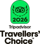 Badge vert avec un symbole d'owlet entouré de feuilles et le texte "2026" en dessous, accompagné de la mention "Tripadvisor Travellers' Choice"